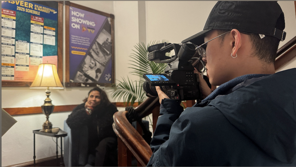 Yangchen carrying a camera.